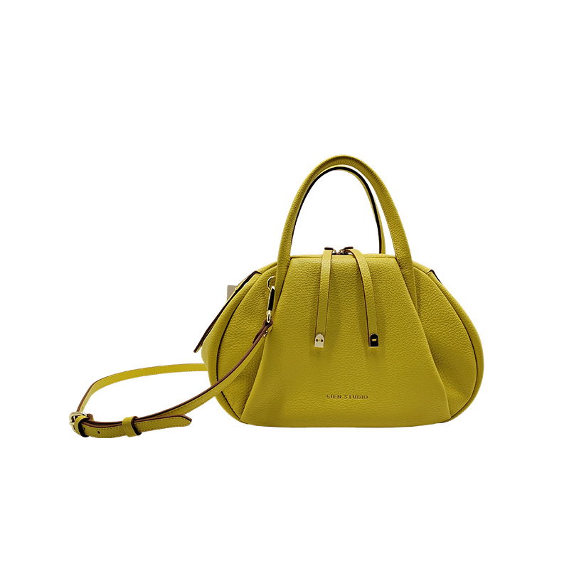 How does a genuine leather women's handbag define elegant everyday style with its craftsmanship and timeless quality?